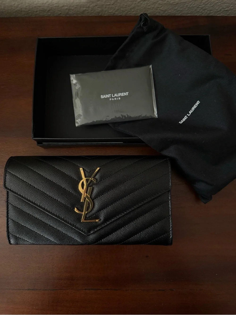 Saint Laurent Cassandre YSL Monogram Large Flap Wallet in grained leather